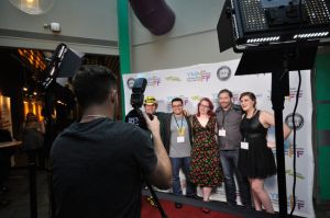Photographer Rick Falls, front, takes a photo on the red carpet of the Fort McMurray International Film Festival in Fort McMurray Alta. on September 5, 2015. Back, left to right: Todd Hillier, Tito Guillen, Theresa Wells, Steve Reeve, Ashley Laurenson. Garrett Barry/Fort McMurray Todayé Postmedia Network